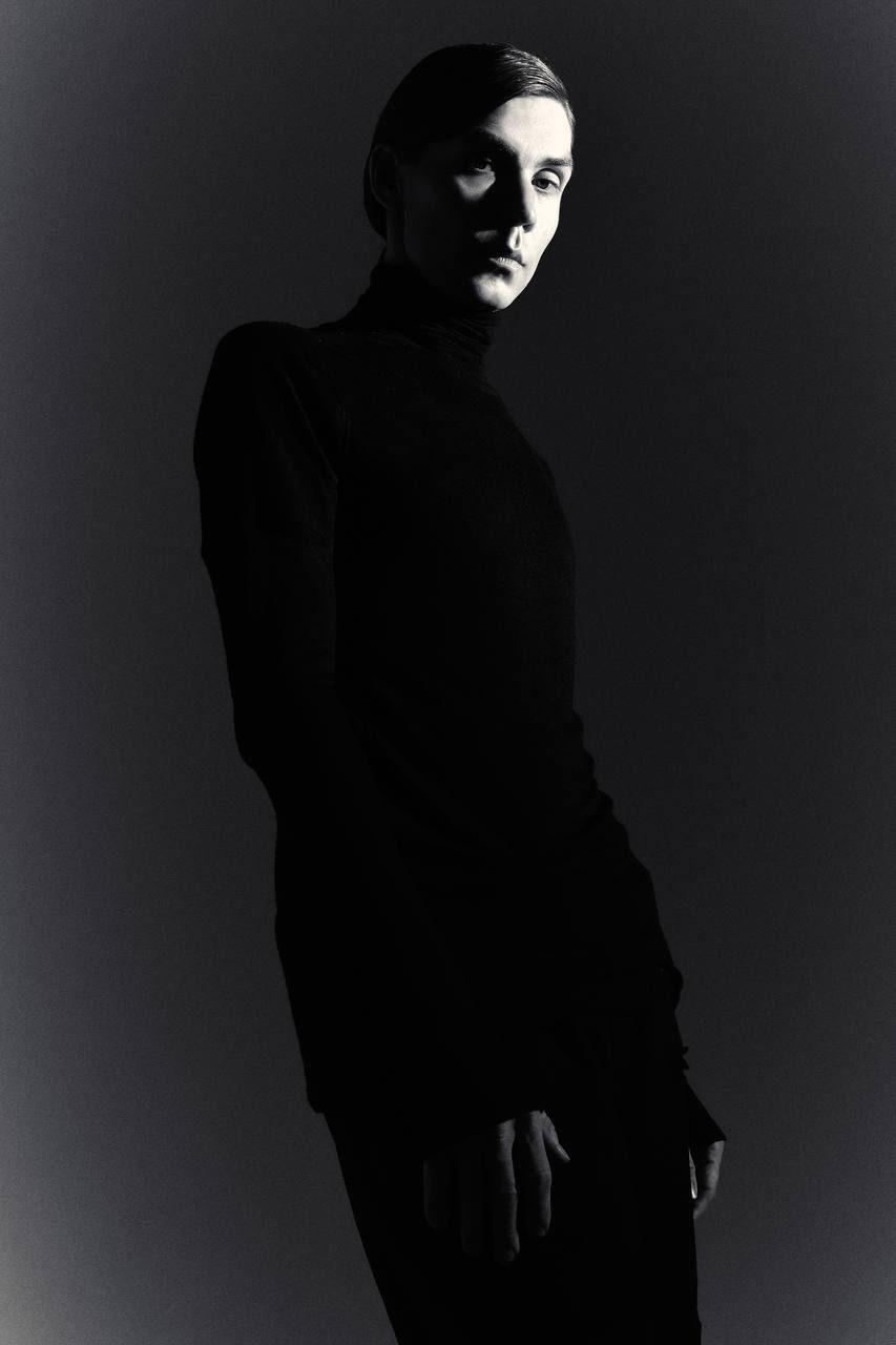 Black-and-white portrait of Nikita Zabelin in a black turtleneck