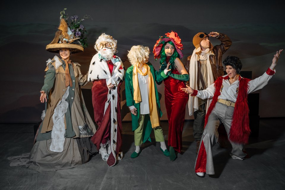The cast of Stories of the Little Prince in costume on stage