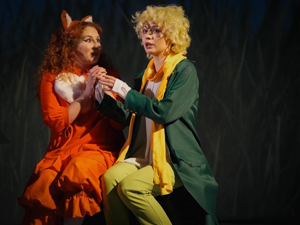 The Fox and the Little Prince sitting close together