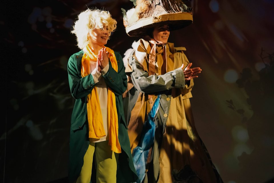The Little Prince next to a character in a tall hat and a long coat